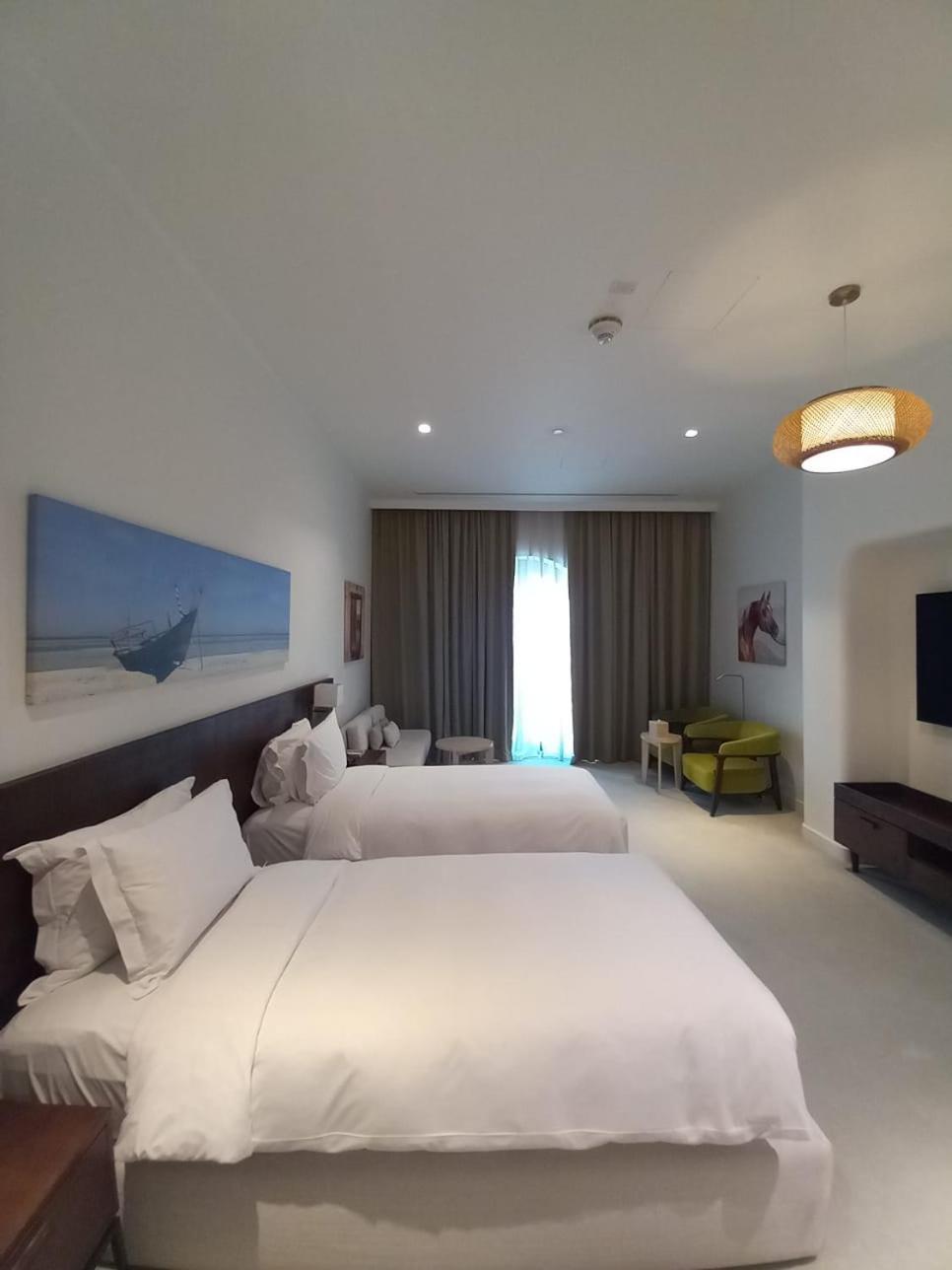 Mina Hotel And Residences By The Torch Doha Kültér fotó A room at the hotel
