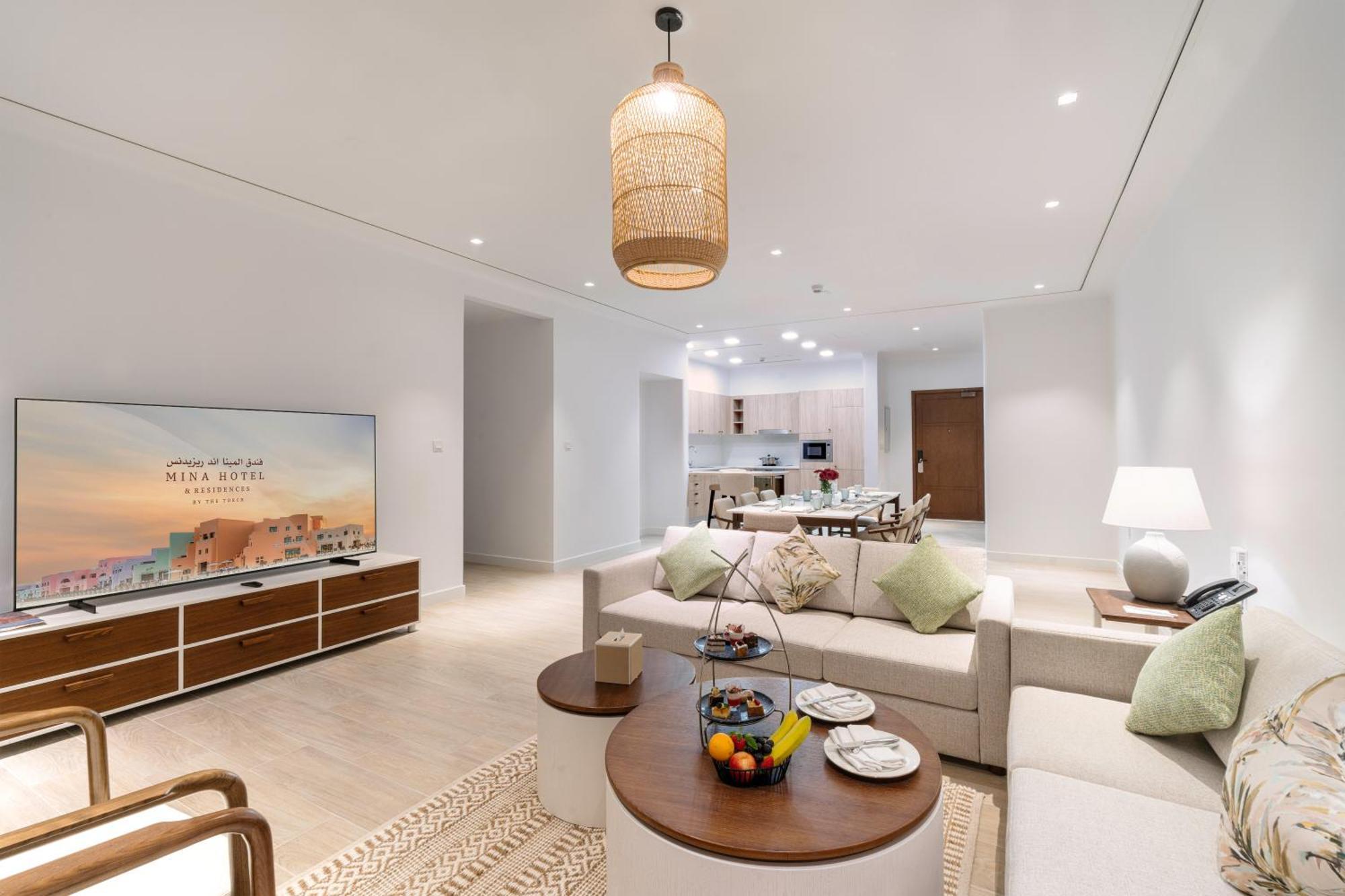 Mina Hotel And Residences By The Torch Doha Kültér fotó A living room at the Ritz-Carlton, DIFC