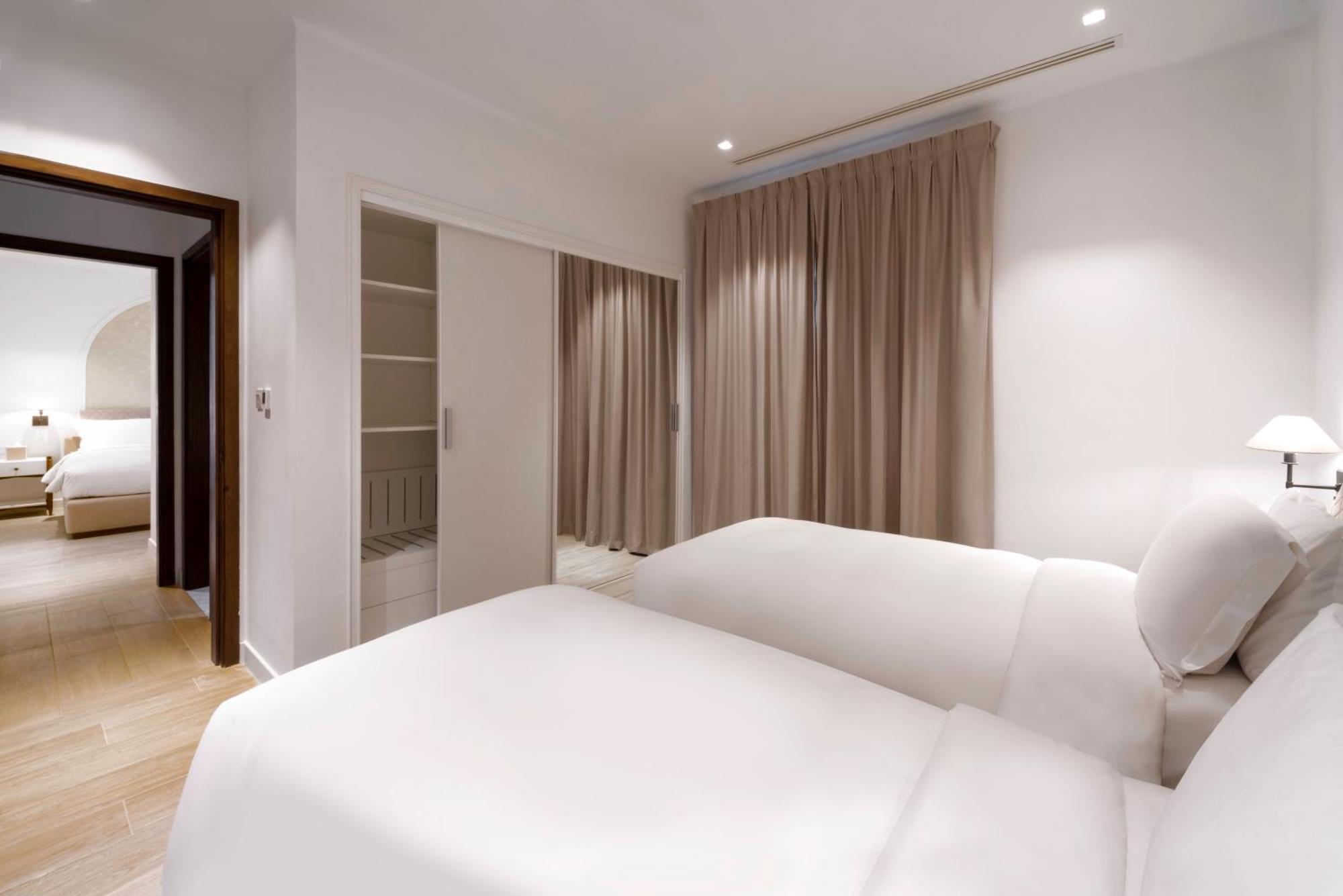 Mina Hotel And Residences By The Torch Doha Kültér fotó A bedroom at the hotel