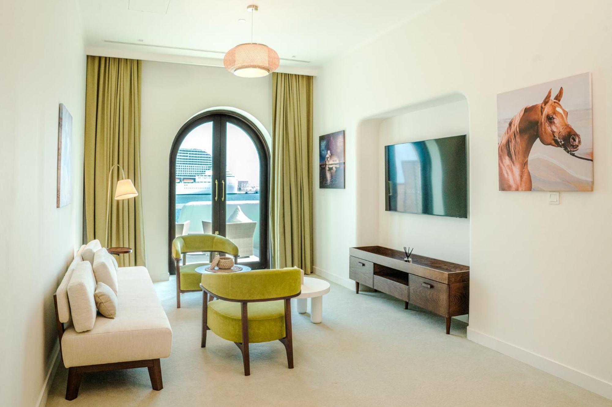 Mina Hotel And Residences By The Torch Doha Kültér fotó A living room at the hotel