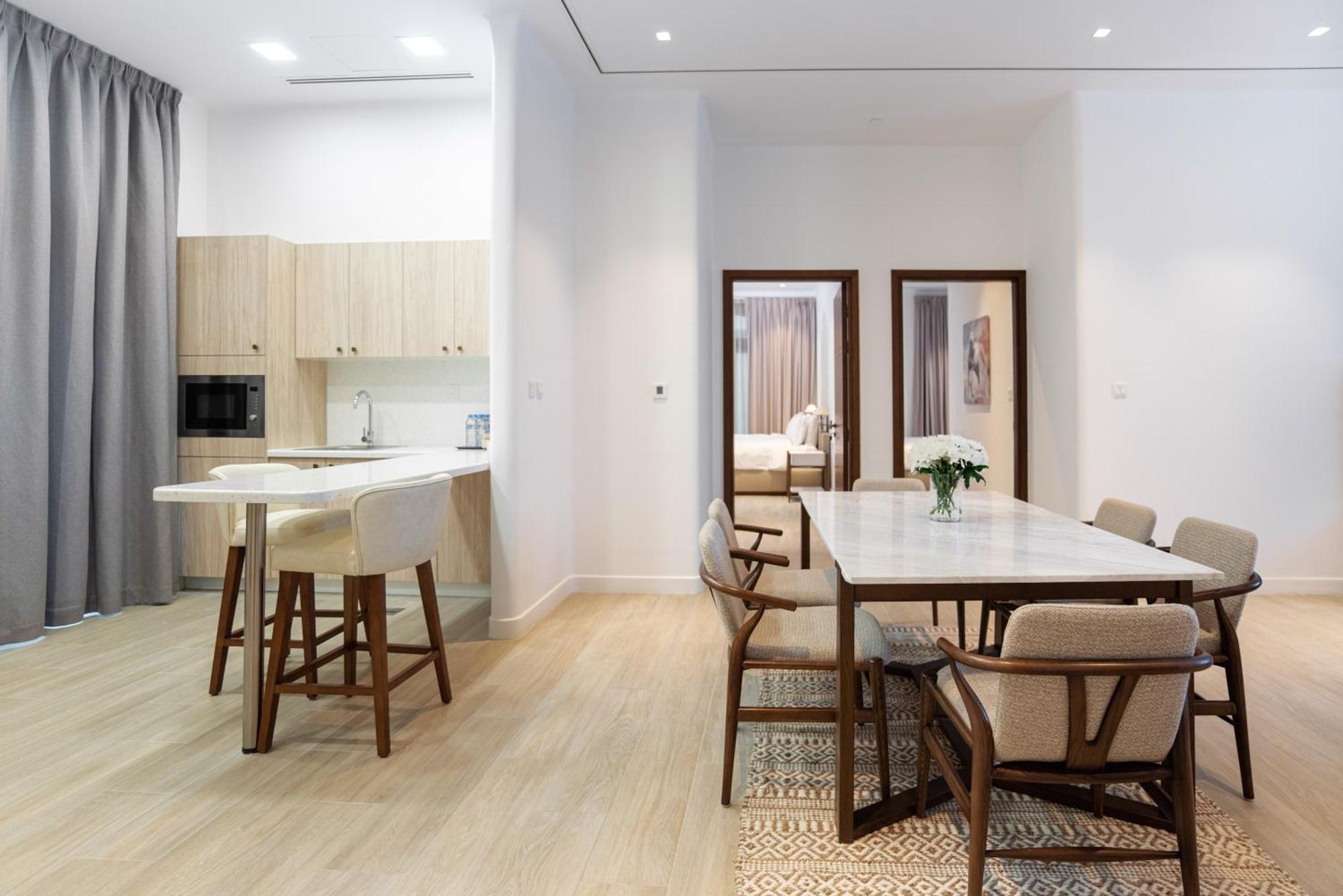 Mina Hotel And Residences By The Torch Doha Kültér fotó A typical apartment interior