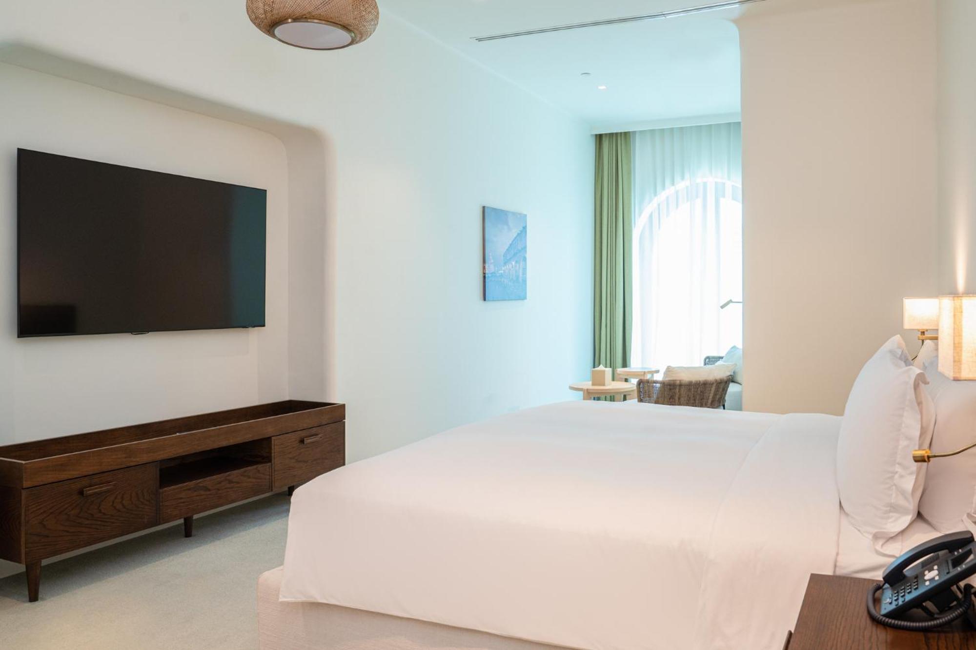 Mina Hotel And Residences By The Torch Doha Kültér fotó A bedroom at the hotel